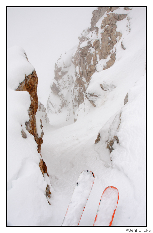 steep rock walled chute in pow in may