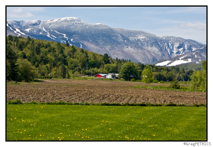 Mansfield over a farm field being sown